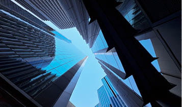 Worms eye view of building structures and the sky