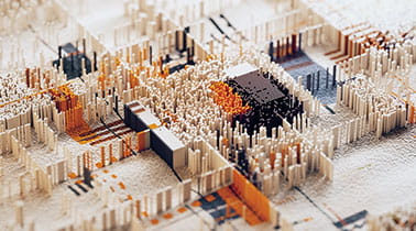 Close-up of a detailed paper model depicting a miniature cityscape with buildings and streets.