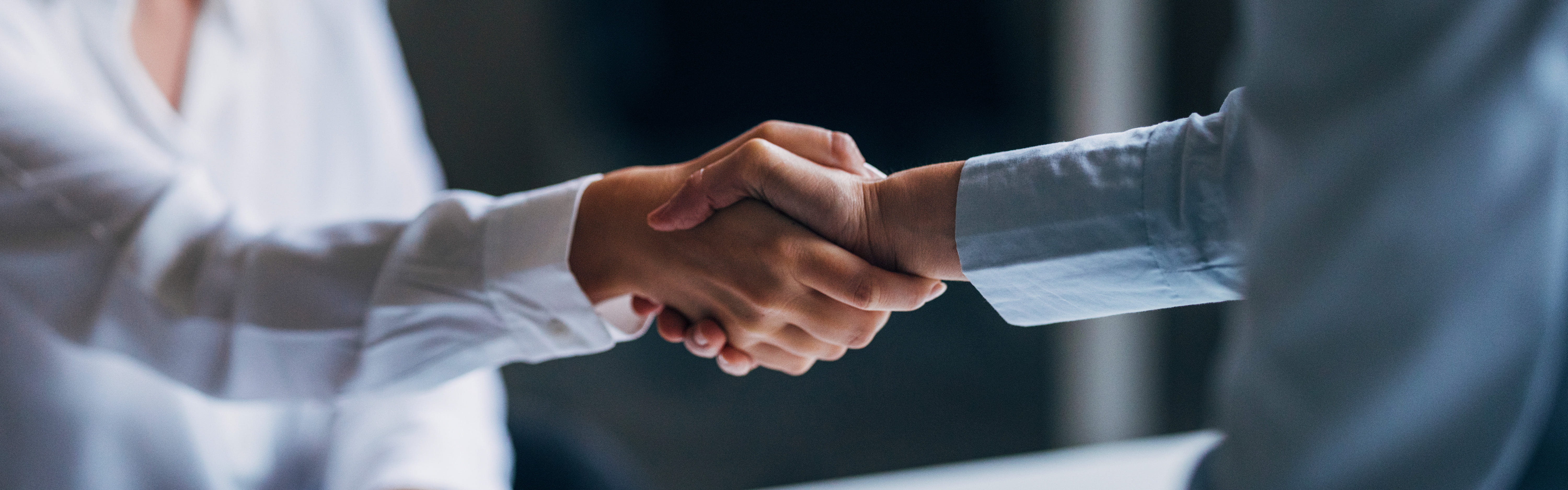 Man and woman shaking hands