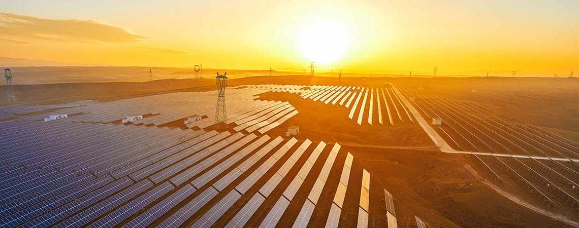 Sunset over a solar panel field