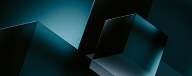 Abstract 3D render of dark geometric glass prisms illuminated by teal edge lighting.
