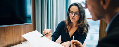 Man and woman examining a document