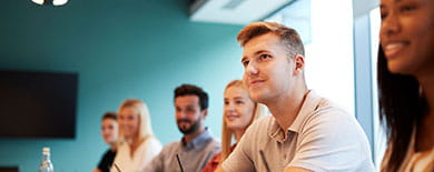 A group of professionals in a meeting room