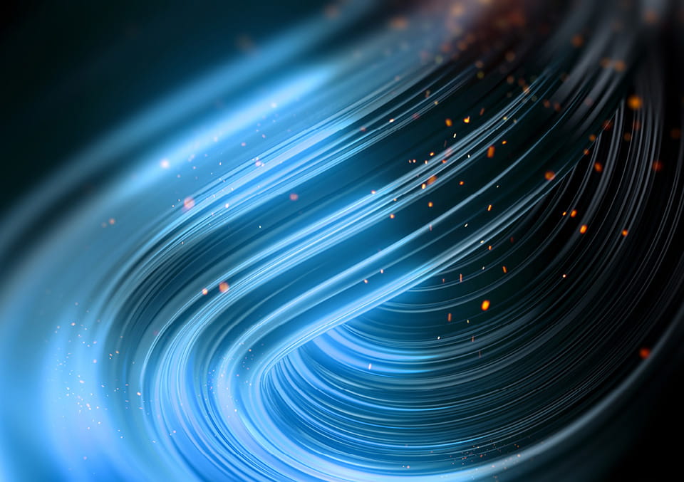 Curved blue light streaks with glowing orange sparks on dark background used in our Ahead of the Deal series